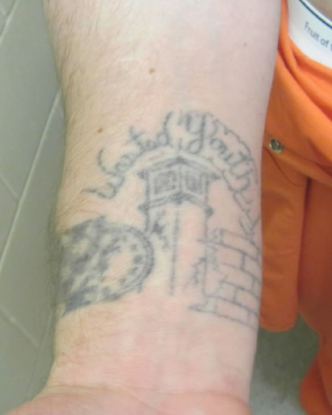 Ernest Adams right forearm tattoo